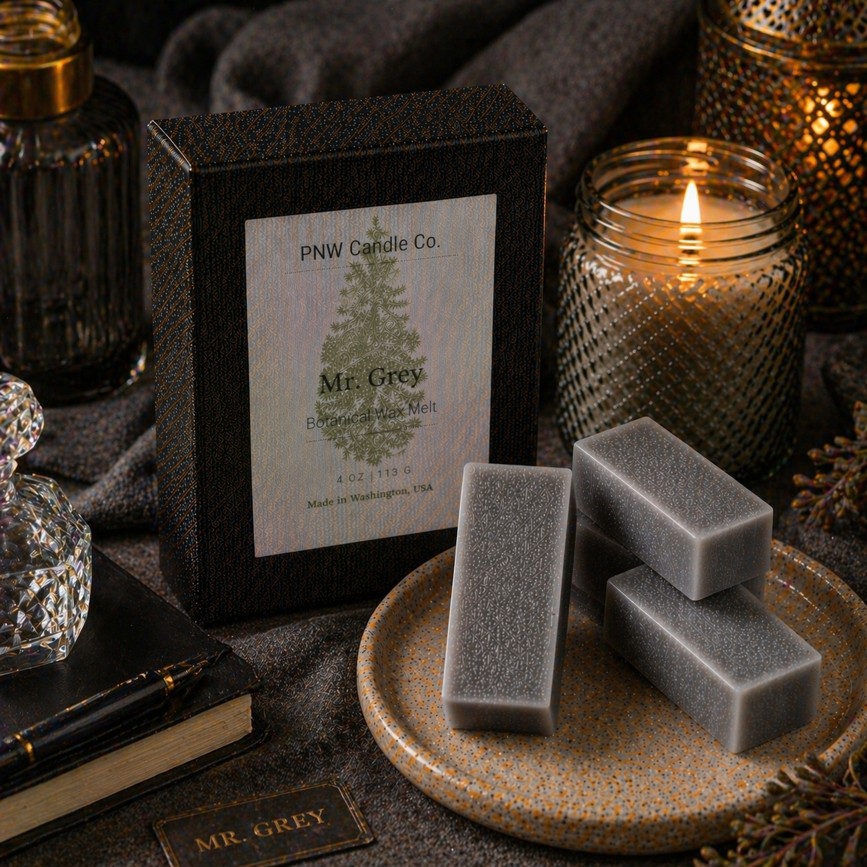 Mr. Grey scented wax tart from PNW Candle Co, showing a pink and white wax melt with floral and grey accents, designed for wax warmers.