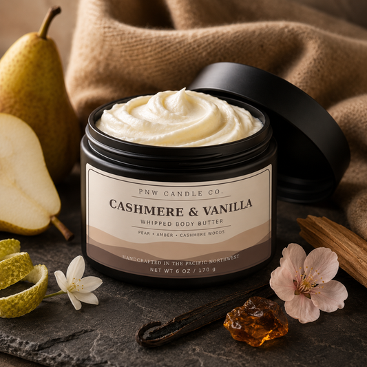 Cashmere & Vanilla 6 oz whipped body butter in a matte-black jar with pear, vanilla, blossoms, and warm cashmere.