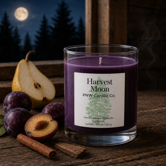 Harvest Moon scented candle by PNW Candle Co with deep-purple wax, pear, plum, and cinnamon beneath a full moon.
