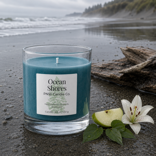 Ocean Shores scented candle by PNW Candle Co with aqua-blue wax on a rain-washed Washington coast.