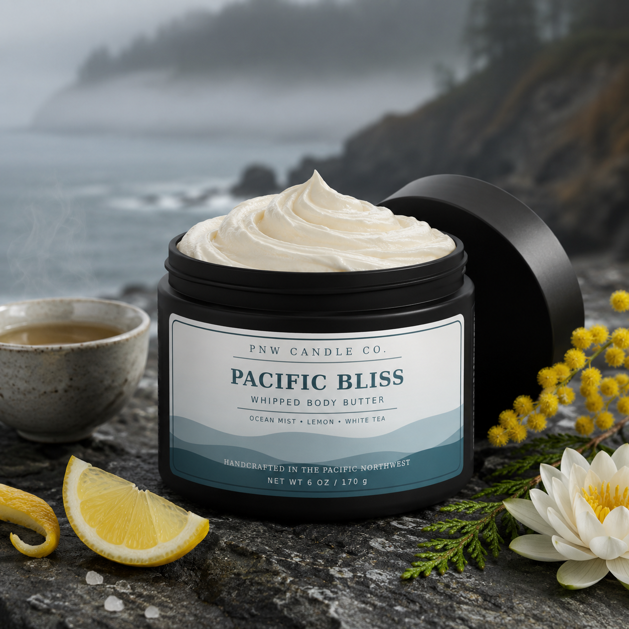 Pacific Bliss 6 oz whipped body butter in a matte-black jar with lemon, white tea, sea salt, and coastal botanicals.
