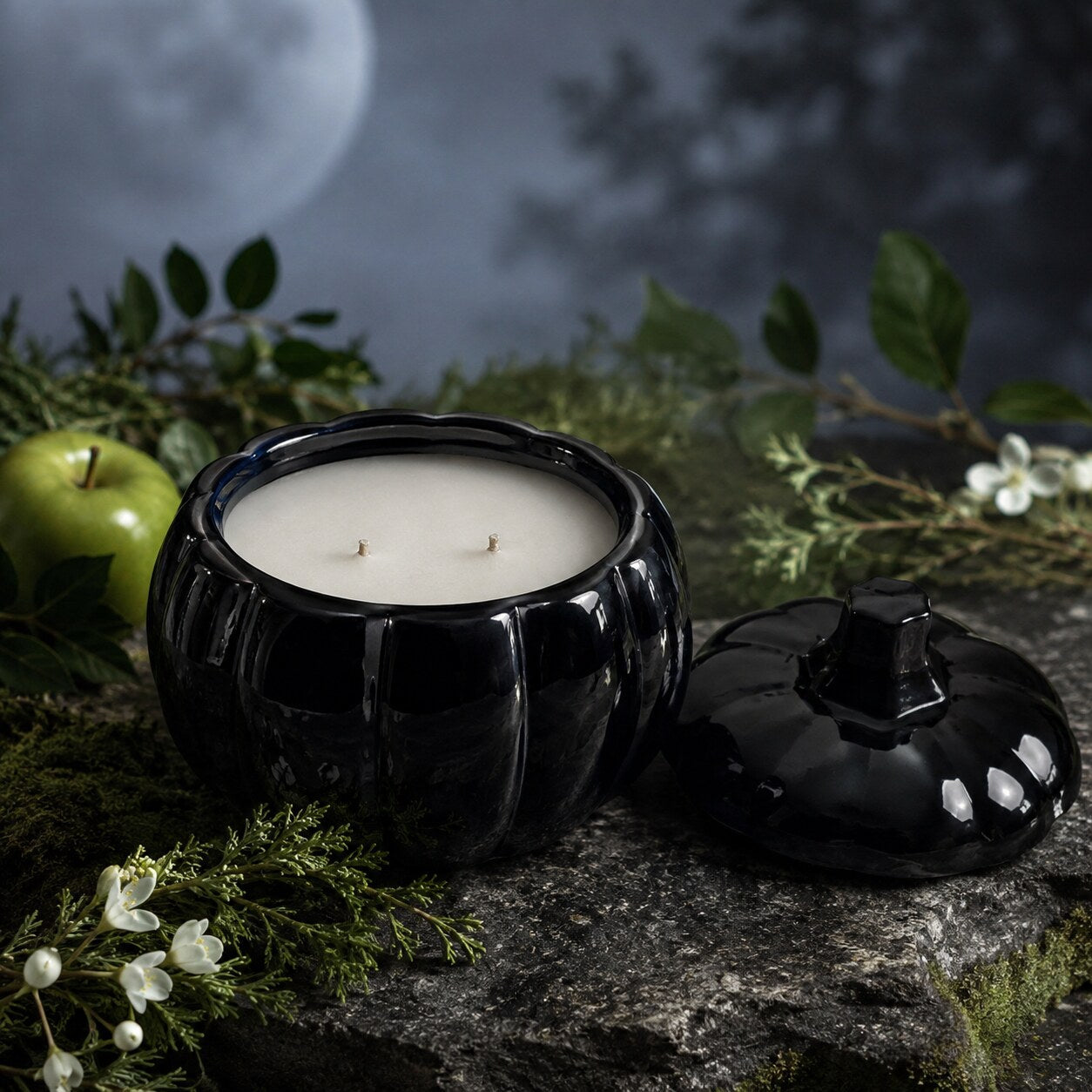 Open Selenite Glow 15 oz candle showing ivory coconut apricot wax and two cotton wicks beside its glossy black pumpkin lid.